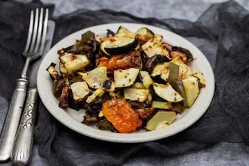 Wall Mural - Mixed baked vegetables on light brown dish