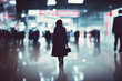 © Robert Kneschke - Lonely businesswoman walking in airport hall or convention center (Generative AI)