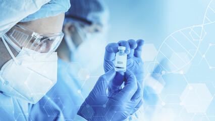 Wall Mural - research scientist holding vaccine bottle in hand on modern clinical laboratory background