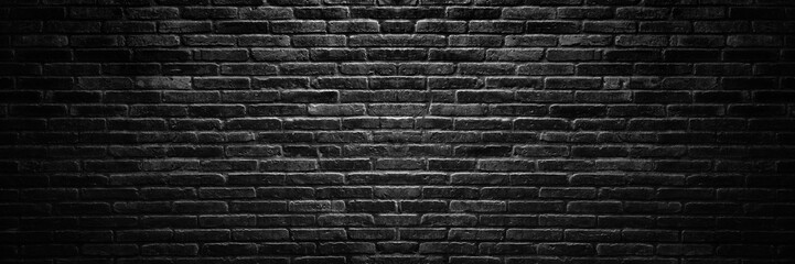 Old vintage retro style dark bricks wall for abstract brick panorama background and texture.