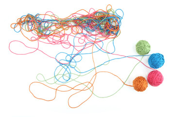 Wall Mural - tangled colorful cotton threads and balls isolated on white background. abstract thread lines chaos 