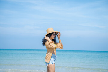 Wall Mural - Pretty slim girls at tropical sea beach,Enjoy and fun outdoor activity lifestyle on holiday travel vacation at the sea.