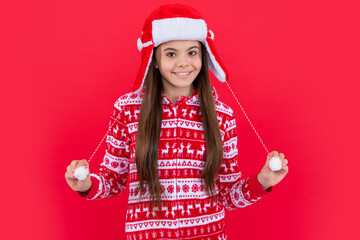 merry christmas. happy teen girl in red christmas santa earflap hat in studio. santa christmas girl