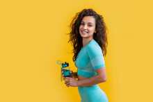 Glad Fitness Woman With Sport Water Bottle In Studio. Fitness Woman Hold Sport Water Bottle