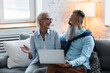 Happy loving senior couple having fun together, watching movies, making video call with family. Mature man and woman using modern technologies, having active life. concept of pensioner leisure time