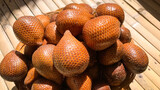 Salak fruit or Salacca on wooden background