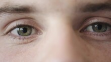 Green Eyes, Macro And Man With Focus, Vision And Eye Care Background While Thinking, Staring And Looking Intimidating For Investigation And Surveillance. Zoom Of Male Model Face With Natural Texture