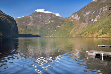 Wall Mural - view on beautiful  geiranger fjord in Norway with reflection of mountain in the water