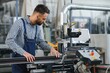 © Serhii - Worker in uniform working on machine in PVC shop indoor