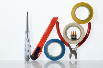 Wall Mural - Different tools for electronics repair laid out on a white background