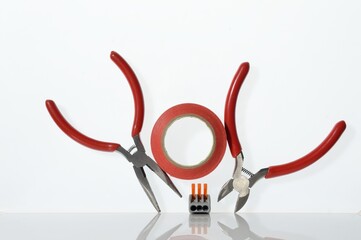 Wall Mural - Different tools for electronics repair laid out on a white background