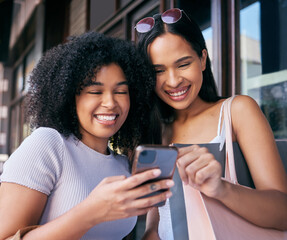 Wall Mural - Women, phone and online shopping in Cape Town street, read ecommerce website on retail shopping app in city. Happy friends, black woman and mobile tech, customer or promo notification on smartphone