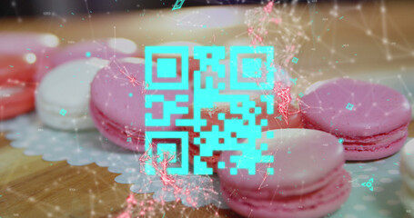 Sticker - Blue QR code with a red floating web of connections over pink macaronies lying on a table