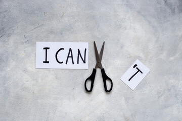 Change your life concept. I cannot cutting into I can with scissors