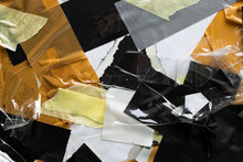 Collage Of Overlapping Pieces Of Black, White, Brow And Grey Masking Tape On Torn Paper