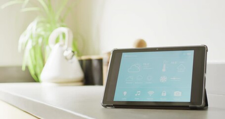 Wall Mural - video of tablet with smart home interface screen on worktop in sunny, modern kitchen