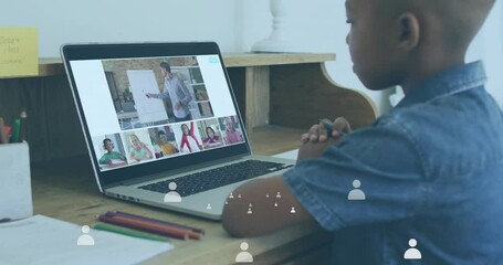 Wall Mural - Animation of icons and data processing over african american schoolboy online schooling on laptop