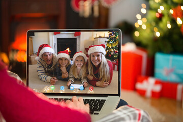 Sticker - Caucasian woman having christmas video call with caucasian family