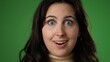 © Robert Peak - Closeup portrait of excited young woman 20s anticipate great success, winner, WOW, isolated on green screen background.