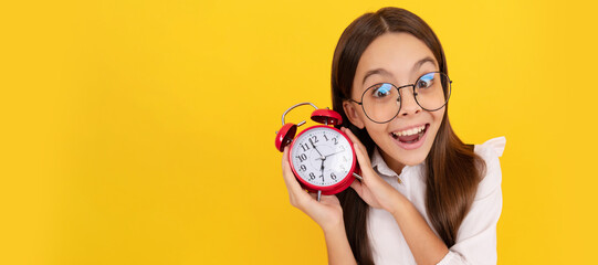 Canvas Print - punctuality. last chance. punctual teen girl checking time. amazed nerd child listen the alarm. Teenager child with clock alarm, horizontal poster. Banner header, copy space.