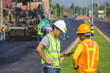© เลิศลักษณ์ ทิพชัย - Male civil engineer working at paved road construction site Control and inspect the quality of paved road construction projects.