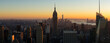 New York City aerial panoramic view of Midtown Manhattan skyscrapers at sunset. The view includes Brooklyn (left), Lower Manhattan and New York Harbor (in the distance) and the Hudson River (right)