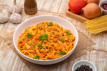 Wall Mural - Spicy Shrimp Spaghetti with Tomato Sauce in white plate,linguine pasta