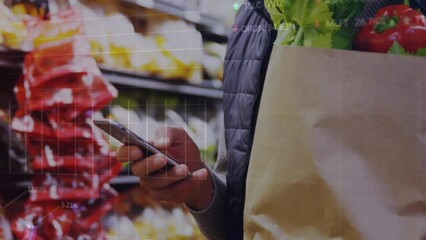 Sticker - Animation of graphs, trading board over midsection of caucasian man using cellphone in supermarket