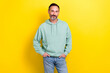 © deagreez - Photo of smiling cheerful middle mature man wear khaki sweatshirt hands pockets look you advert new clothes brand isolated on yellow color background
