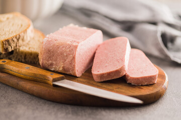 Wall Mural - Luncheon meat on cutting board.