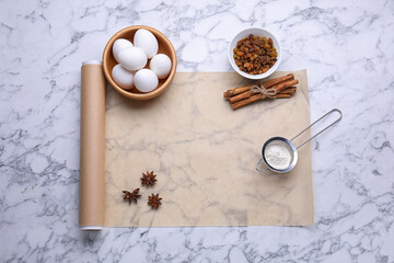 Canvas Print - Roll of baking parchment paper and different ingredients on white marble table, flat lay. Space for text