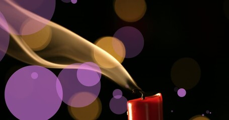 Wall Mural - animation of violet and yellow dots over fading out candle on black background