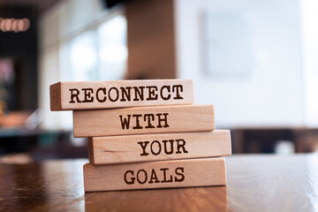 Wall Mural - Wooden blocks with words 'Reconnect with your goals'.