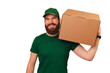 © Vulp - Strong delivery man wearing green uniform holds a carton box over his shoulder over white background.