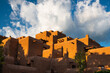 Dramatic white storm clouds over a pueblo style adobe building in Santa Fe, New Mexico