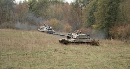  two British army FV4034 Challenger 2 ii main battle tanks in action on a military combat exercise, Wiltshire UK