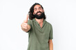 © luismolinero - Young man with beard over isolated white background shaking hands for closing a good deal