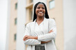 © Mia B/peopleimages.com - Arms crossed, happy vision and black woman with power, business and motivation for corporate success in the city of Portugal. Idea, smile and African employee with pride, professional and thinking