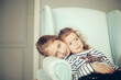 © yurolaitsalbert - portrait of two little sisters sitting in a chair