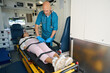 © Viacheslav Yakobchuk - Doctor tightens seat belts on body of patient in ambulance