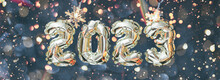 Helium Balloon Number Of Year 2023 Against The Backdrop Of The Snowflakes Garlands. Cozy Fairytale Atmosphere. New Year Card