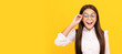 amazed teen girl in school uniform and glasses for vision protection, eyewear. Child face, horizontal poster, teenager girl isolated portrait, banner with copy space.