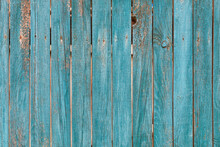 Old Wooden Fence With Faded Green Paint Texture.