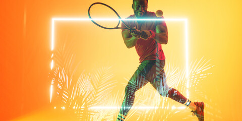 Wall Mural - African american male player playing tennis with racket by illuminated rectangle and plants