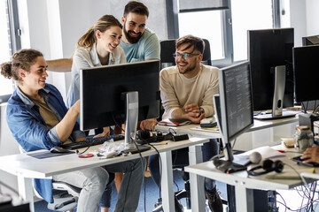 Group of programmers and game developers working on a new project at the office.	
