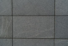 Gray Tile Wall Front View Tiles In The Shape Of Large Rectangles Texture And Background Of Granite Street Tiles