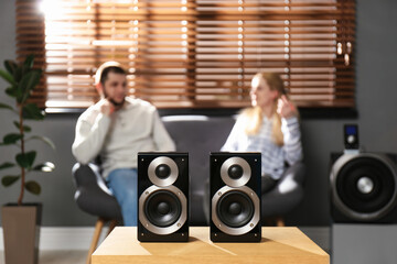 Wall Mural - People enjoying music with modern audio speaker system in living room