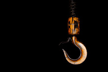 Crane Hook. The System Of Pulleys And Ropes. Close Up Crane Hook For Overhead Crane. Isolated On Black Background.