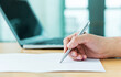 © xy - Hand taking business notes at office