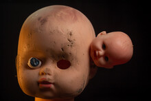 Damaged Dirty Dubl Doll Head On Black Background Isolated